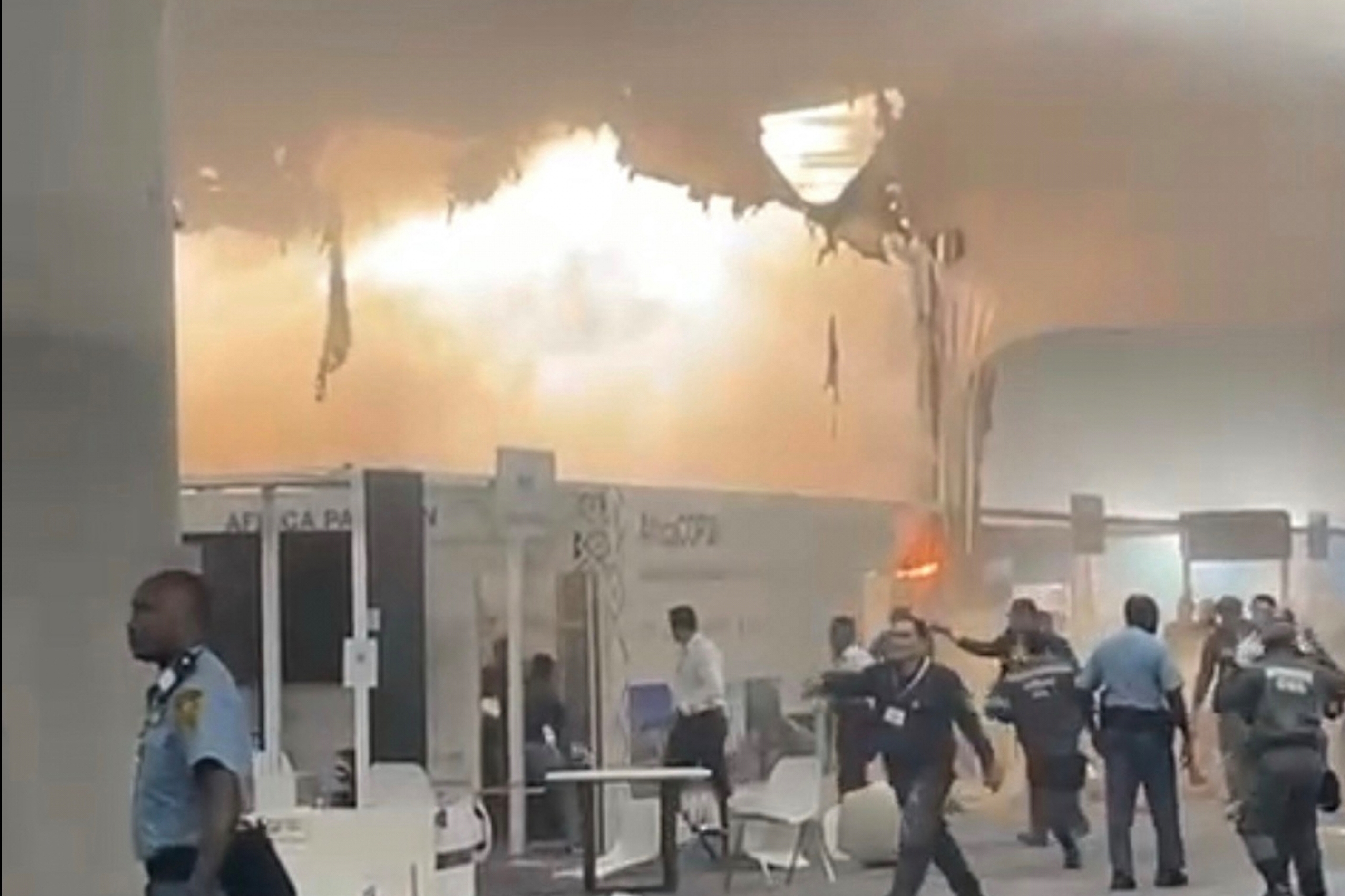 In this frame from video provided by Catherine Ellis, flames engulf pavilions at the COP30 U.N. Climate Summit on Thursday in Belem, Brazil.